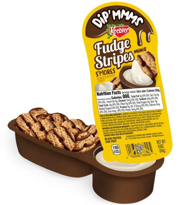 A Keebler Dip'mmms Fudge Stripes S'mores snack pack is shown, featuring a brown plastic tray with mini Fudge Stripes cookies and a separate compartment containing a white marshmallow-flavored dipping cream. The yellow and brown label on the packaging highlights the product name and brand, with a graphic of the cookies being dipped into the cream.